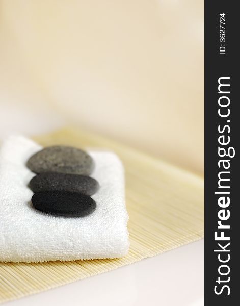 Pebble stones on white towel. Pebble stones on white towel