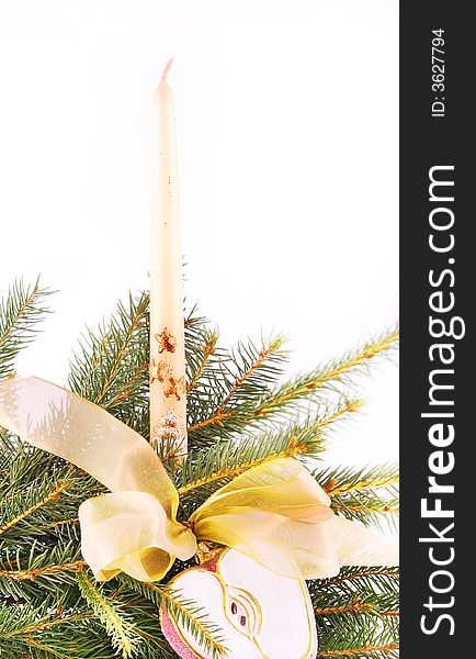 Christmas candle with gold ribbon isolated on white. Christmas candle with gold ribbon isolated on white