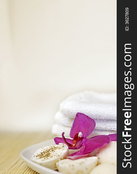 Natural oil soaps with orchid flower and white towel. Natural oil soaps with orchid flower and white towel