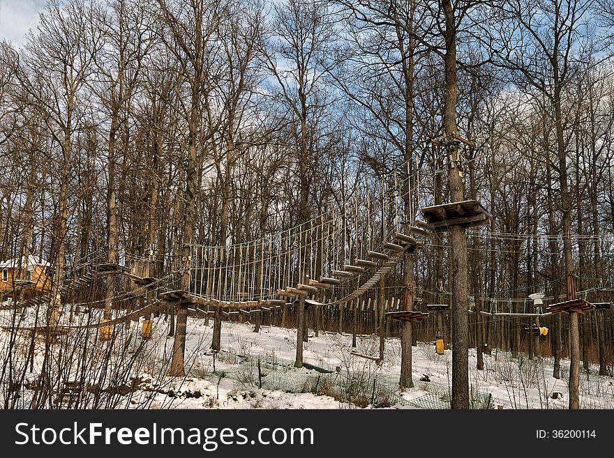 Towable ropes course in the forest in the trees. Towable ropes course in the forest in the trees.