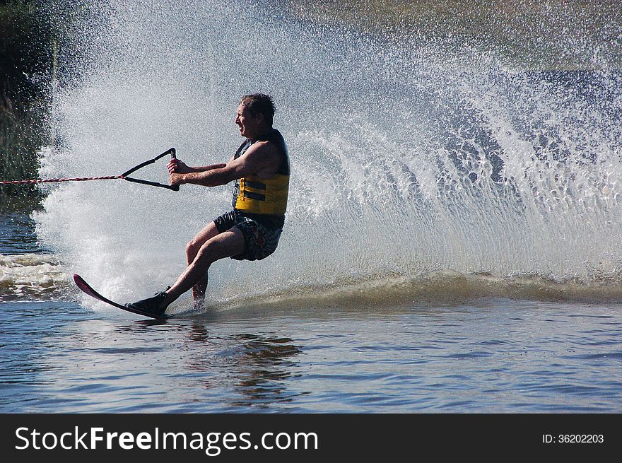 A water skier throws up a wall of white water on Sundays River in South Africa. A water skier throws up a wall of white water on Sundays River in South Africa.