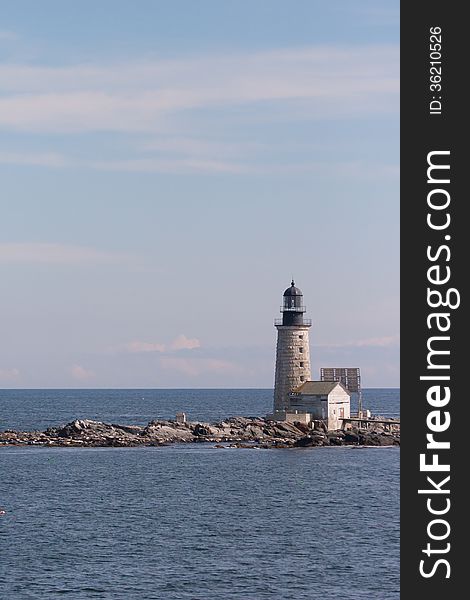 Vertical image of Halfway Rock Lighthouse in Near Harpswell, Maine, in Casco Bay