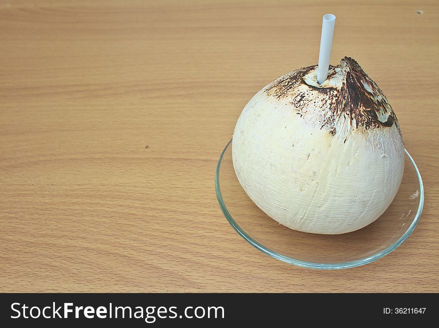 Burn coconut thai food on wooden background