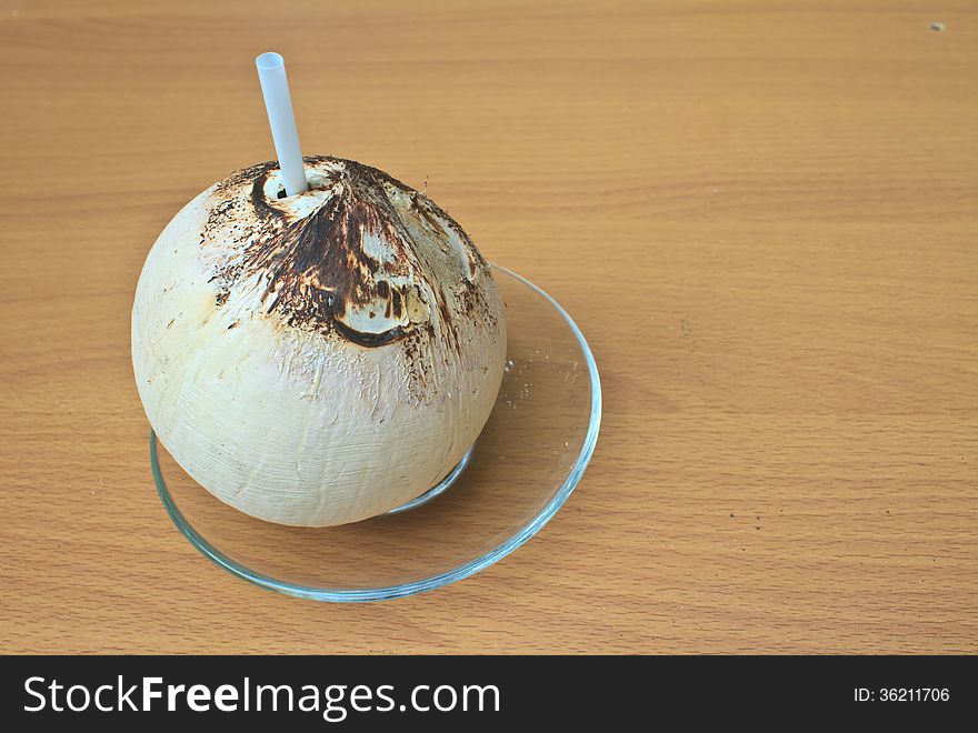 Burn coconut thai food on wooden background