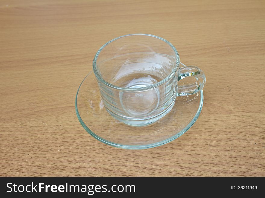 Coffee cup on wood table background