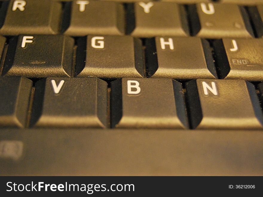 Part of black keyboard and letters