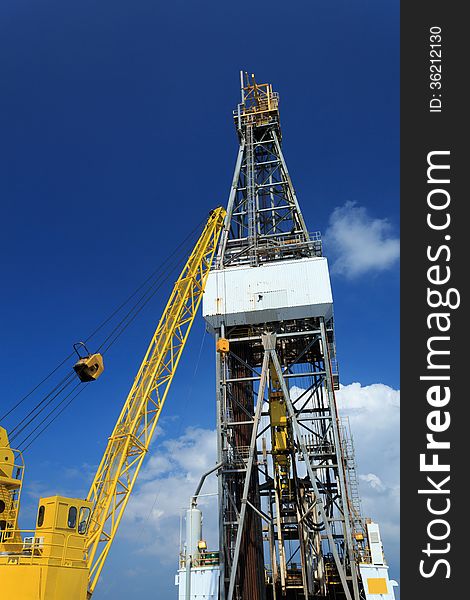 Derrick of Offshore Drill Rig and Rig Crane with Blue Sky