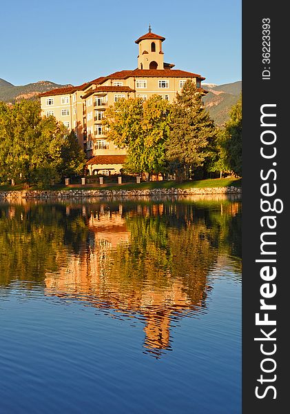 A peaceful pond reflects the Broadmoor hotel. A peaceful pond reflects the Broadmoor hotel