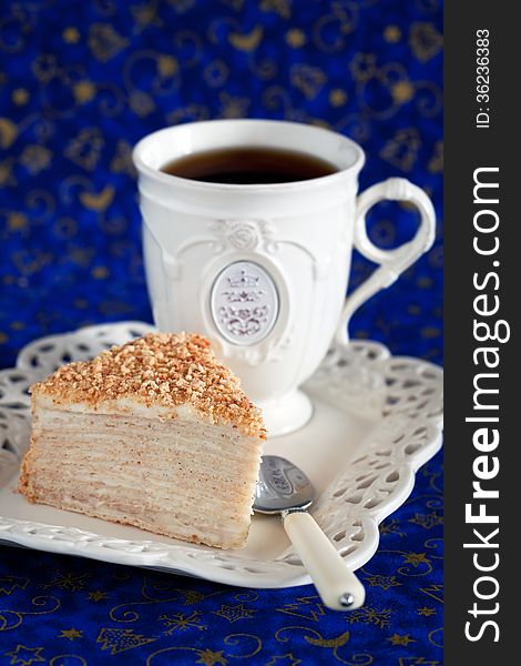 Slice of layer cake with custard Napoleon, selective focus. Slice of layer cake with custard Napoleon, selective focus