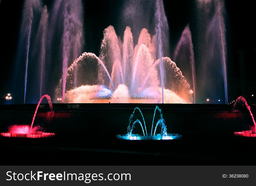 Holiday concept. Nice color fountain on dark background. Holiday concept. Nice color fountain on dark background