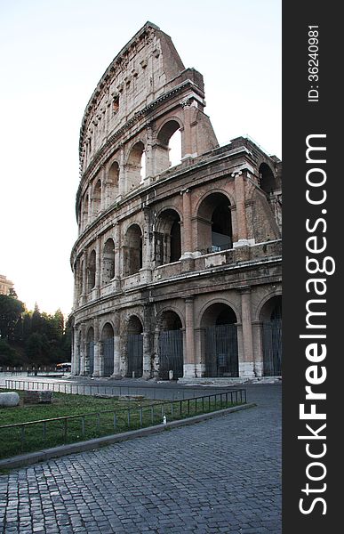 The Roman Colosseum picture taken at 7am in the morning before the rush of foreign tourists and locals,start of the busy day. The Roman Colosseum picture taken at 7am in the morning before the rush of foreign tourists and locals,start of the busy day