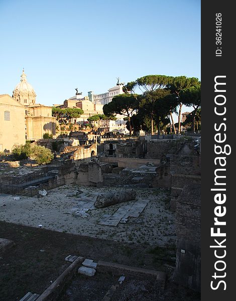 Early morning shot of the Roman Forum walking towards the Vittoriano far in the background. Early morning shot of the Roman Forum walking towards the Vittoriano far in the background