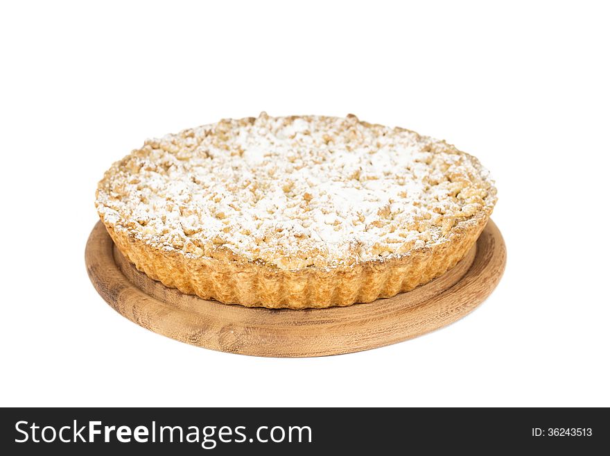 Grated apple pie with icing sugar isolated on white