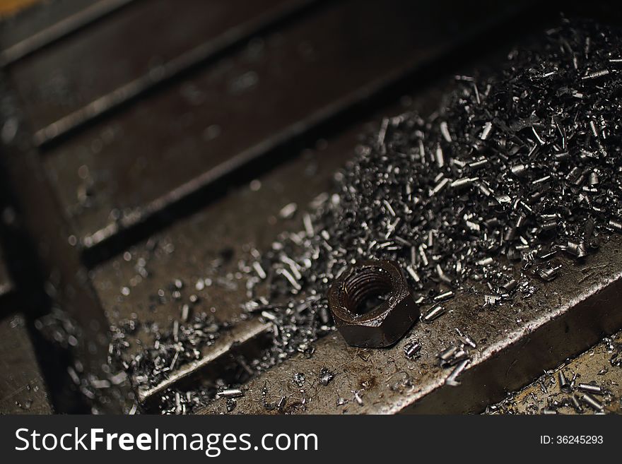 Silver metal shavings on workbench