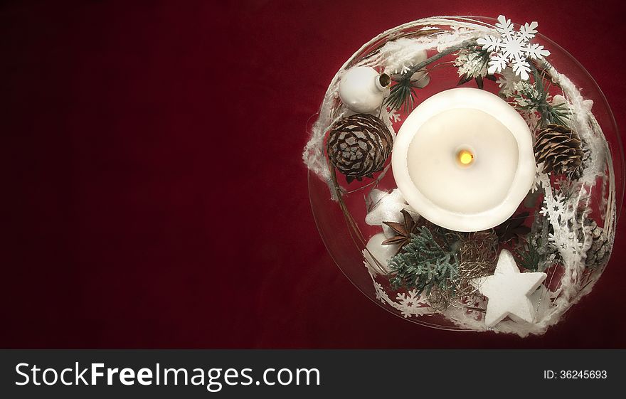 Winter decoration with candles on red background