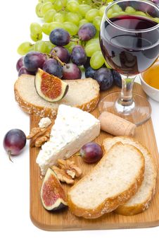 Snacks - Cheese, Bread, Figs, Grapes, Nuts And Red Wine Stock Images Snacks - Cheese, Bread, Figs, Grapes, Nuts And Red Wine Stock Images