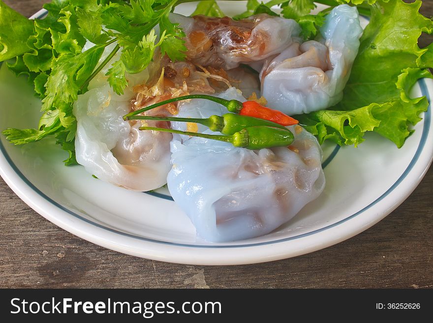 Steamed rice skin dumplings, Thai style dessert on wooden