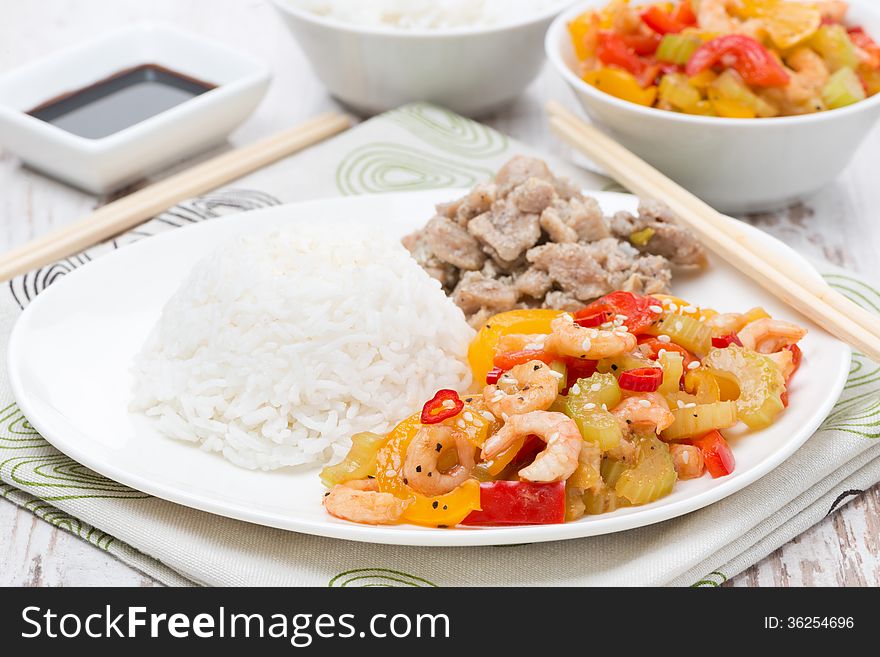Chinese food - rice, chicken and vegetables with shrimp, close-up