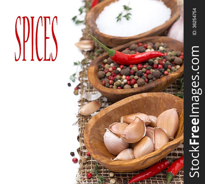 Garlic, hot pepper, sea salt and spices in bowls