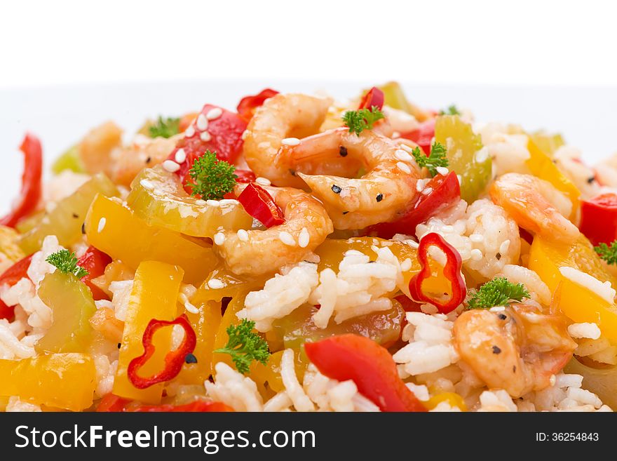 Rice with vegetables and shrimps, close-up, isolated on white