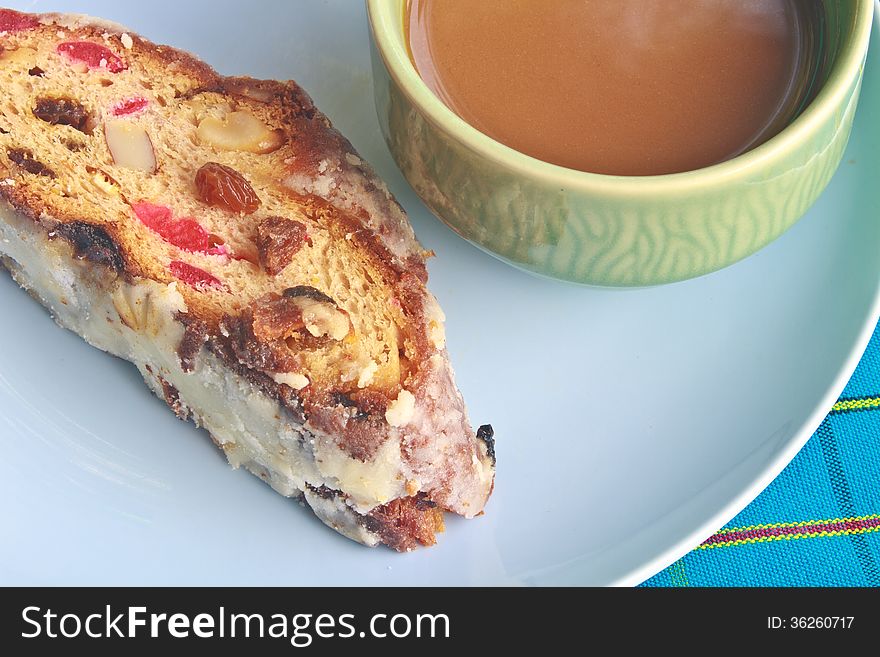 Fruitcake with raisin and Seasoning on table, with hot coffee. Fruitcake with raisin and Seasoning on table, with hot coffee