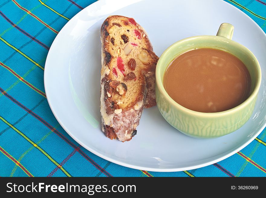 Fruitcake with raisin and Seasoning on table, with hot coffee. Fruitcake with raisin and Seasoning on table, with hot coffee