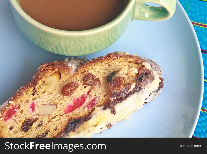 Fruitcake with raisin and Seasoning on table, with hot coffee. Fruitcake with raisin and Seasoning on table, with hot coffee