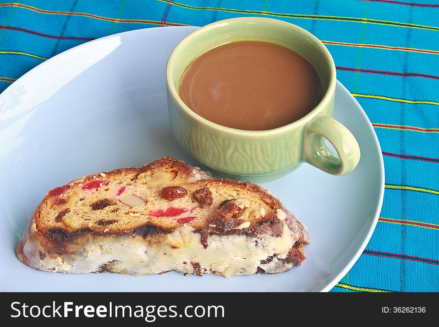 Fruitcake with raisin and Seasoning on table, with hot coffee. Fruitcake with raisin and Seasoning on table, with hot coffee