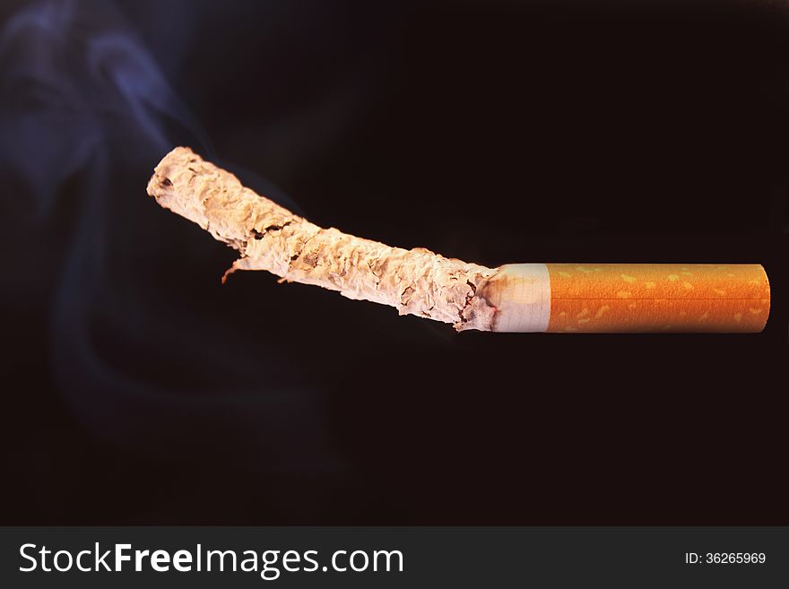 Cigarette as a symbol of human dependence on addictions. Cigarette as a symbol of human dependence on addictions
