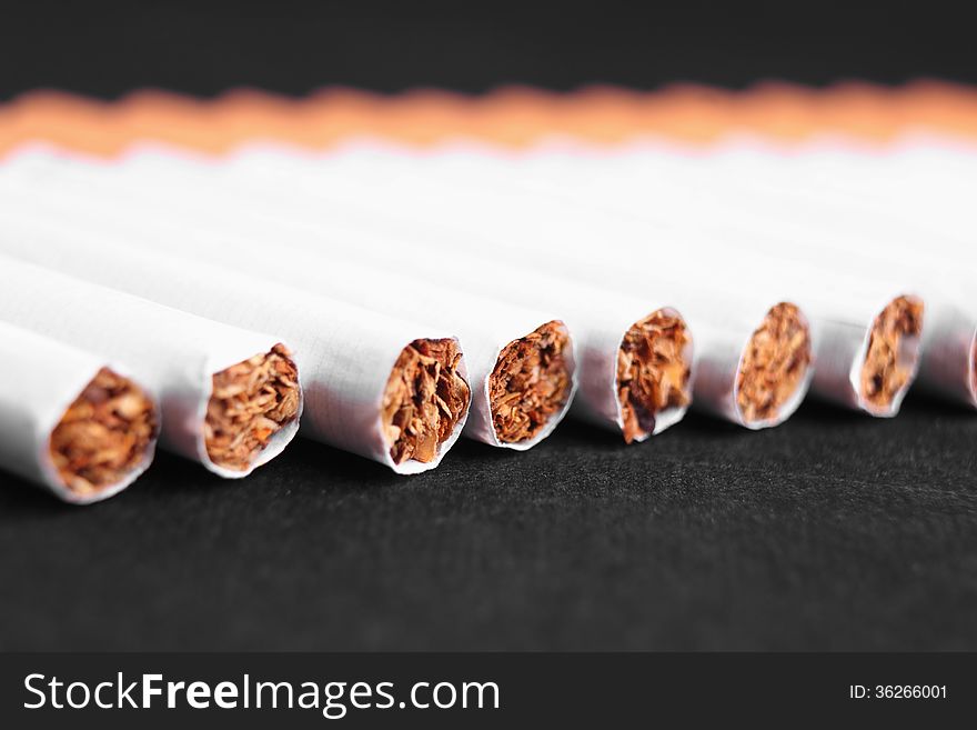 Cigarette as a symbol of human dependence on addictions
