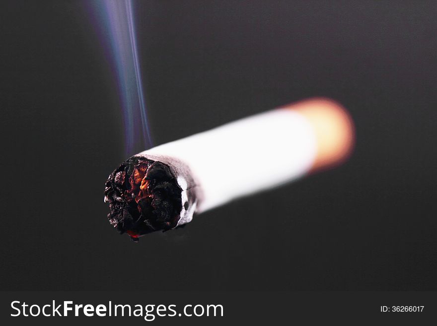Cigarette On A Black Beckground