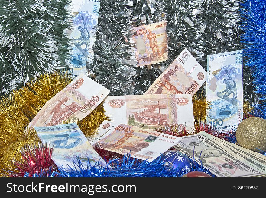 Christmas tinsel and banknotes of rubles. Christmas tinsel and banknotes of rubles.