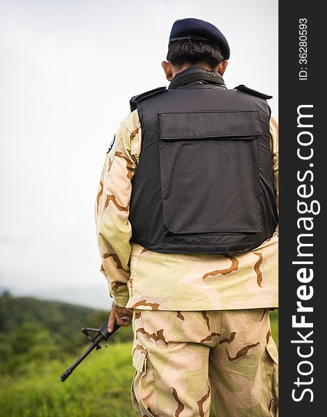 Soldier guardian standing with rifle gun