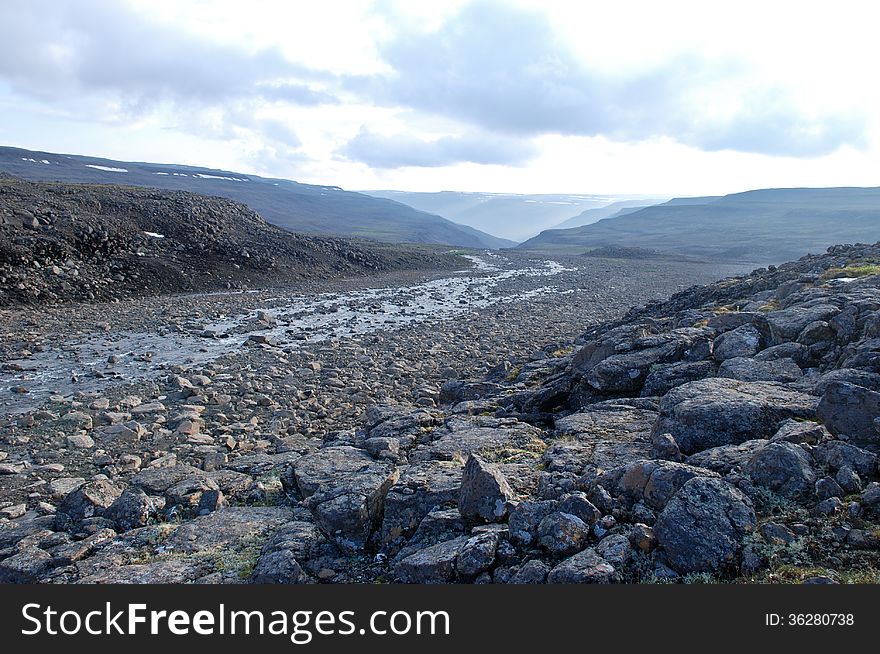 Rocky canyon of the mountain river. Russia, Taimyr Peninsula, Putorana plateau. Rocky canyon of the mountain river. Russia, Taimyr Peninsula, Putorana plateau.