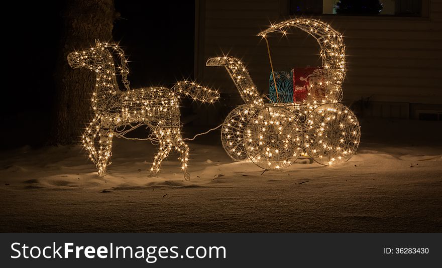 Horse and carriage in christmas lights