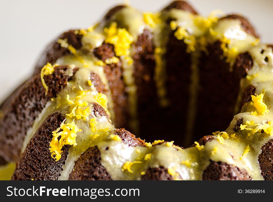 Detail of a cake with royal icing and lemon zest