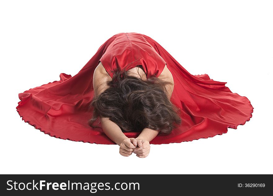 Beautiful woman sitting on the floor, white background