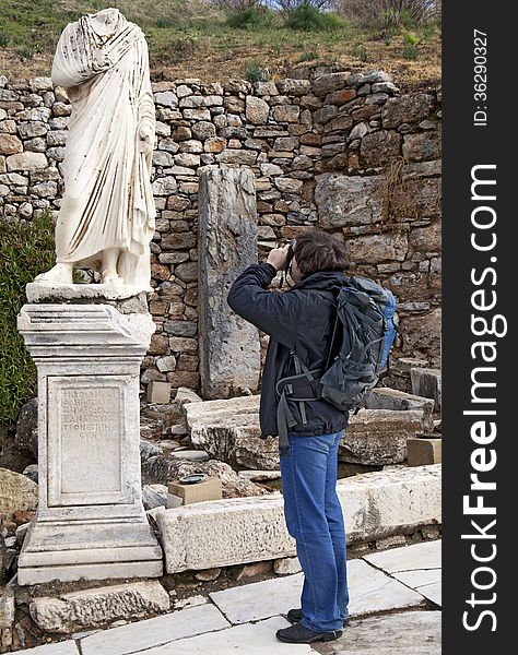 Tourist with a photo camera in Ephesus, Turkey. Tourist with a photo camera in Ephesus, Turkey