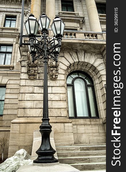 Lampost in front of a historic building downtown Montreal
