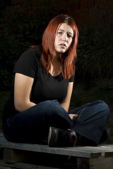 Pensive Girl Sitting On Wood Stock Images Pensive Girl Sitting On Wood Stock Images