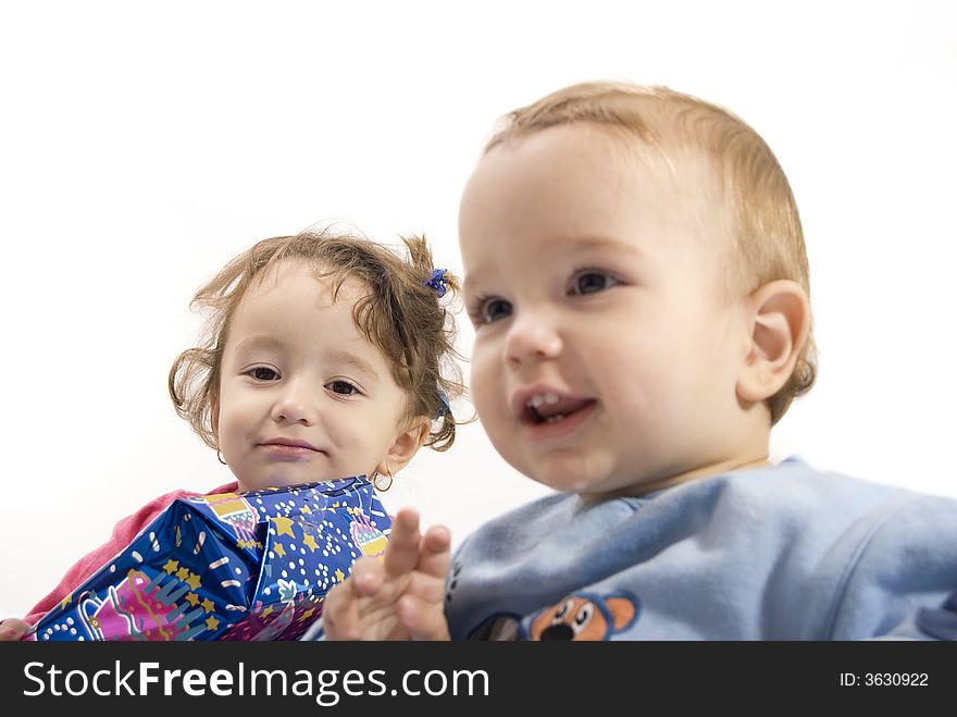 Cute young boy and his sister surprised