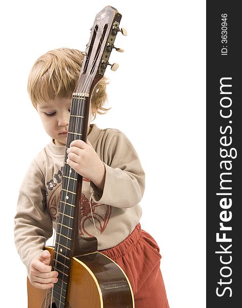 Young girl is playing a guitar. Young girl is playing a guitar