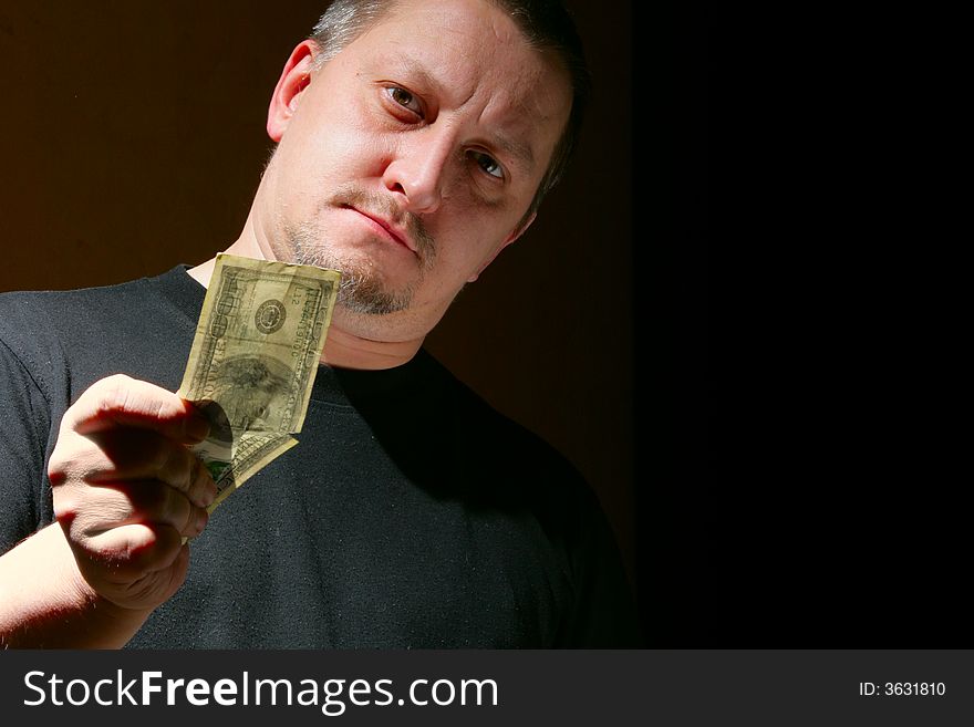 Man offering money over black background with space for your own text on right