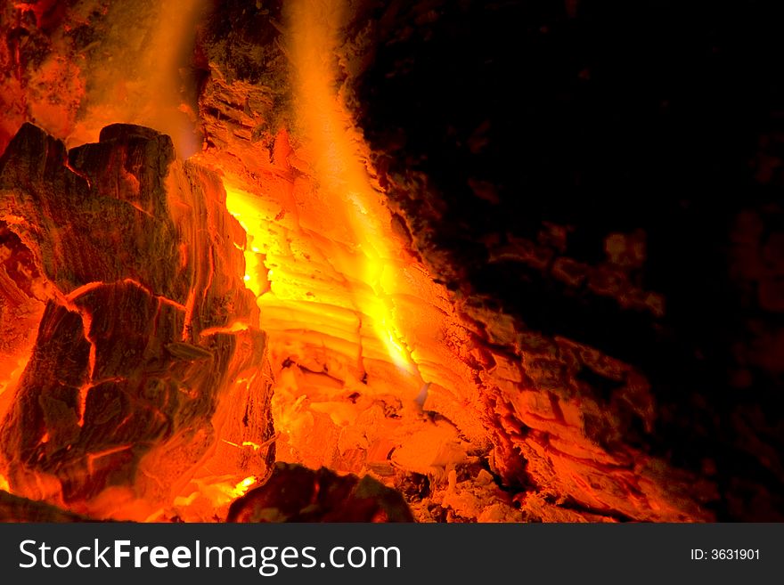 Photo of burning hood in a fireplace