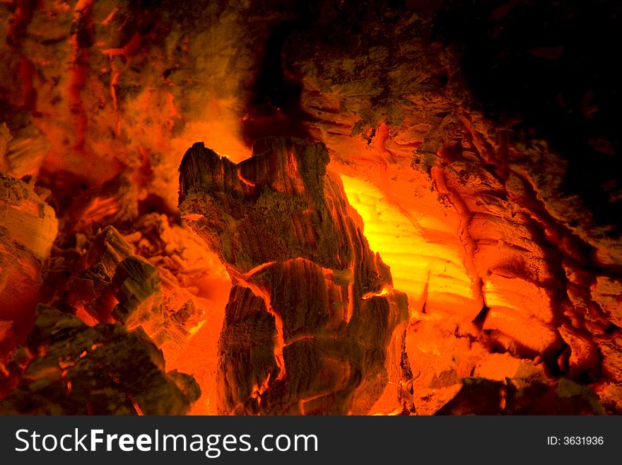 Photo of burning hood in a fireplace