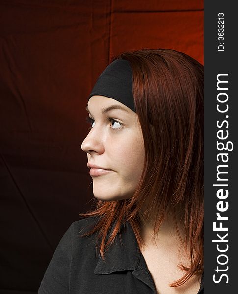 Bored girl looking away.

Shot in studio.