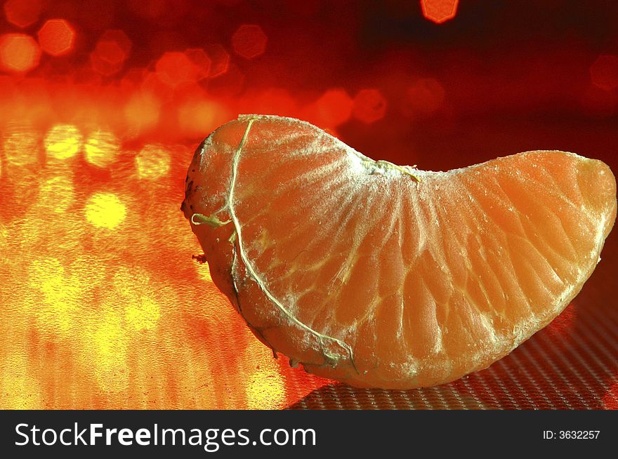 Tangerine on a red background