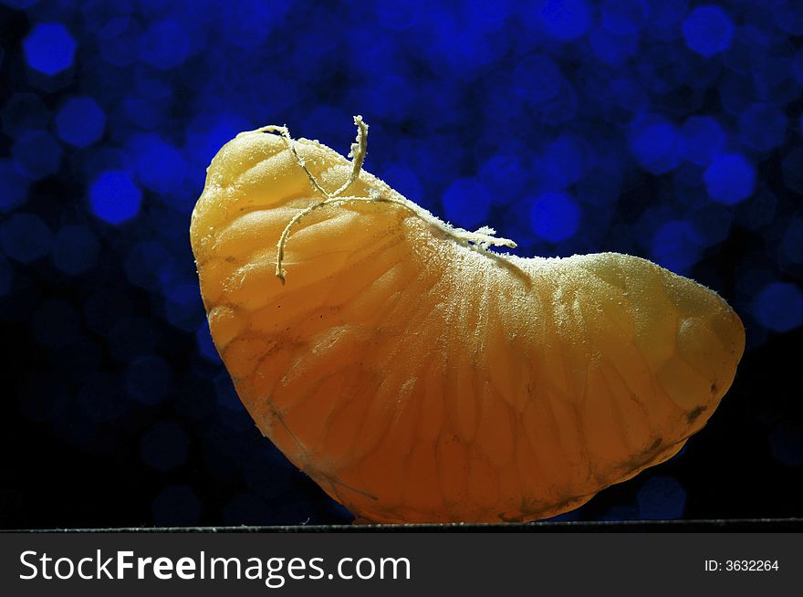 Tangerine on a black background