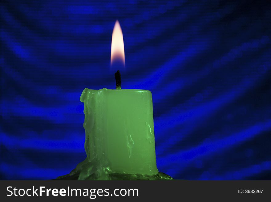 Candle on a dark blue background