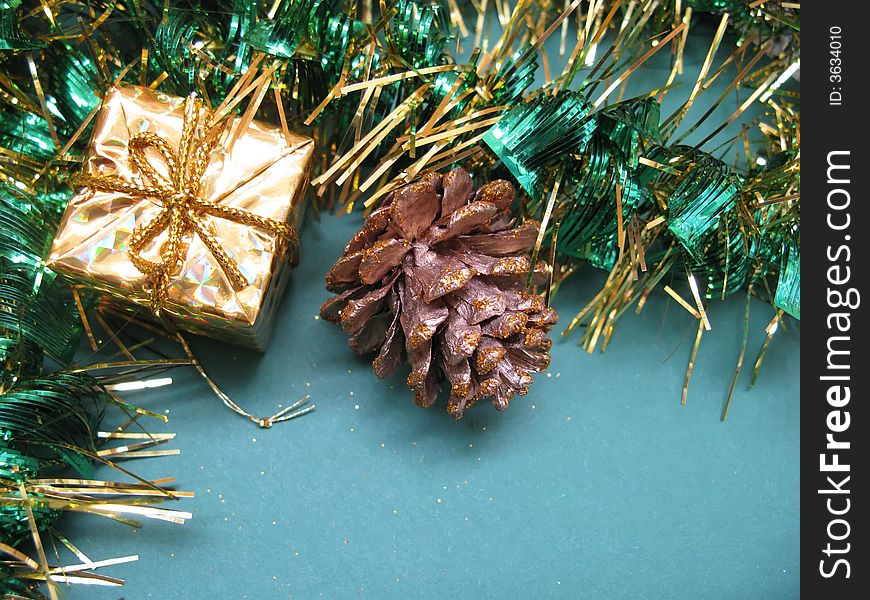 Little box, pine cone and Christmas chains. Little box, pine cone and Christmas chains